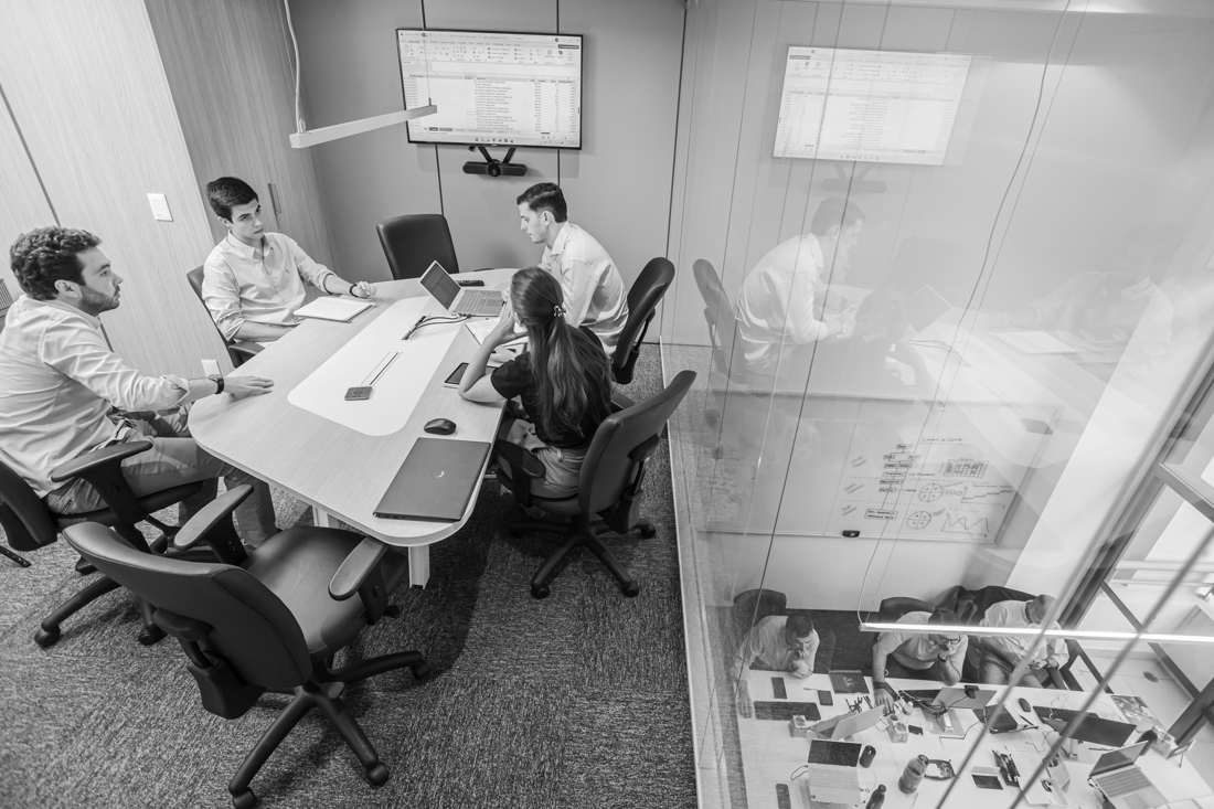 Professionals in a boardroom discussion