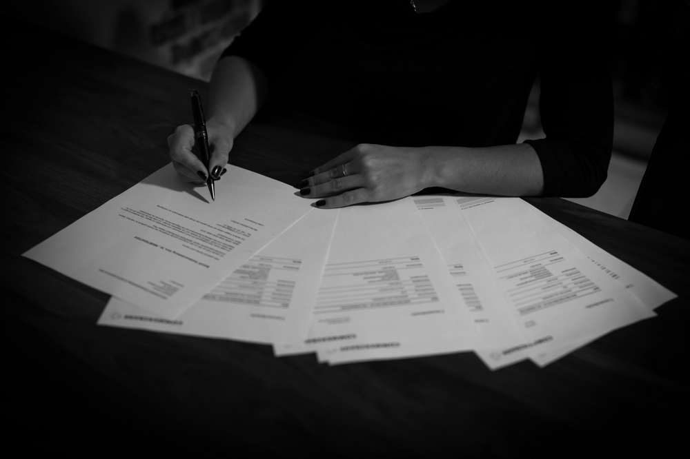Reviewing paperwork at a desk